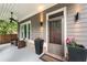 Covered front porch with stylish decor, lighting, and a welcoming entrance at 2412 Boulder Se Rd, Atlanta, GA 30316