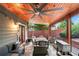 Inviting outdoor patio with a ceiling fan, comfortable seating, and a stone floor at 2412 Boulder Se Rd, Atlanta, GA 30316