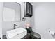 Modern powder room featuring designer sink and fixtures with a dark green toilet at 2412 Boulder Se Rd, Atlanta, GA 30316