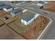 Aerial view of a home with a fenced yard, located in a neighborhood with mature landscaping at 301 Amsterdam Way, Hampton, GA 30228