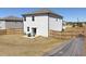 Fenced backyard with a patio and outdoor seating area, perfect for enjoying the outdoors in privacy at 301 Amsterdam Way, Hampton, GA 30228