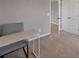 Bedroom with carpet, neutral paint, and a small desk with a chair at 301 Amsterdam Way, Hampton, GA 30228