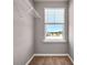 Walk-in closet with carpet flooring and shelving for storage at 301 Amsterdam Way, Hampton, GA 30228