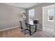 Bright home office with a desk, chair, and natural light at 301 Amsterdam Way, Hampton, GA 30228