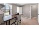 Bright home office with a large desk and neutral colors at 301 Amsterdam Way, Hampton, GA 30228