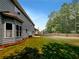A spacious backyard features a lush lawn with a partial view of the home at 3517 Mortons Landing Dr, Ellenwood, GA 30294