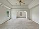 Spacious bedroom featuring neutral carpet, trey ceiling, and ample natural light at 3517 Mortons Landing Dr, Ellenwood, GA 30294