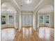 Inviting foyer with hardwood floors, arched doorways, and bay windows at 3517 Mortons Landing Dr, Ellenwood, GA 30294