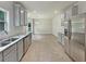 A modern kitchen includes stainless steel appliances and an eat-in area at 3517 Mortons Landing Dr, Ellenwood, GA 30294