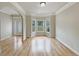 Bright living room featuring hardwood floors and a bay window at 3517 Mortons Landing Dr, Ellenwood, GA 30294