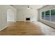 The spacious living room features wood floors, a fireplace, and large windows at 3517 Mortons Landing Dr, Ellenwood, GA 30294