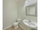 A powder room features a pedestal sink and large mirror at 3517 Mortons Landing Dr, Ellenwood, GA 30294