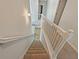 Carpeted staircase with white railing leading to the upper level at 3517 Mortons Landing Dr, Ellenwood, GA 30294
