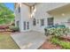 Back patio with grass, trees, and a grill at 4360 Canterbury Walk Dr, Duluth, GA 30097