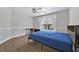 Bedroom with wood floors, ceiling fan and a large window at 4360 Canterbury Walk Dr, Duluth, GA 30097