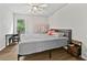 Bedroom featuring wood-look flooring, ceiling fan, and natural light at 4360 Canterbury Walk Dr, Duluth, GA 30097