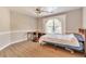 Spacious bedroom features neutral walls, ceiling fan and a window at 4360 Canterbury Walk Dr, Duluth, GA 30097