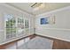 Elegant dining room showcasing hardwood floors, ample natural light, and stylish chandelier at 4360 Canterbury Walk Dr, Duluth, GA 30097