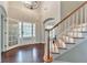 Bright foyer with hardwood floors, staircase and decorative glass doors at 4360 Canterbury Walk Dr, Duluth, GA 30097