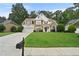 Inviting home showcasing a stone and stucco exterior, tidy lawn, and an attached two-car garage at 4360 Canterbury Walk Dr, Duluth, GA 30097