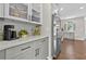 Modern kitchen showcasing white cabinetry, sleek hardware, stainless steel appliances, and elegant quartz countertops at 4360 Canterbury Walk Dr, Duluth, GA 30097