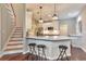 Modern kitchen with white cabinets, quartz countertops, a kitchen island, and stainless steel appliances at 4360 Canterbury Walk Dr, Duluth, GA 30097