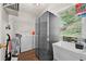 Functional laundry room with a utility sink, storage shelves, washer, dryer, and a large stainless steel refrigerator at 4360 Canterbury Walk Dr, Duluth, GA 30097