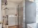 Laundry room with stainless steel refrigerator, washer, dryer, and laundry sink at 4360 Canterbury Walk Dr, Duluth, GA 30097