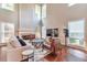 Bright living room featuring high ceilings, fireplace, and hardwood floors at 4360 Canterbury Walk Dr, Duluth, GA 30097