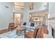 Open-concept living room featuring fireplace, hardwood floors and plenty of light at 4360 Canterbury Walk Dr, Duluth, GA 30097