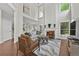 Spacious living room with fireplace, hardwood floors, and views to the kitchen at 4360 Canterbury Walk Dr, Duluth, GA 30097
