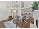 Open-concept living room with hardwood floors, fireplace, and bright, airy feel at 4360 Canterbury Walk Dr, Duluth, GA 30097