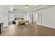 Spacious primary bedroom with trey ceilings, wood floors and a view of the en suite bathroom at 4360 Canterbury Walk Dr, Duluth, GA 30097