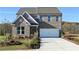 Beautiful two-story brick home with a well-manicured lawn and attached two-car garage at 505 Regency Trl, Acworth, GA 30102