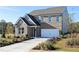 Charming two-story brick home with a manicured front yard and a two-car garage at 505 Regency Trl, Acworth, GA 30102