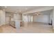 Open concept kitchen leading to living space, modern appliances, hardwood floors at 120 Felicity Pike, Locust Grove, GA 30248