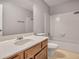 Bathroom featuring vanity, toilet and shower and tub at 1417 Poplar Pointe Se, Smyrna, GA 30082