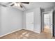 Bedroom featuring neutral paint, ceiling fan and entry door to bathroom at 1417 Poplar Pointe Se, Smyrna, GA 30082