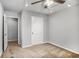 Bedroom featuring neutral paint, ceiling fan and entry door at 1417 Poplar Pointe Se, Smyrna, GA 30082