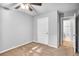 Bedroom featuring a ceiling fan and a doorway to an attached bathroom at 1417 Poplar Pointe Se, Smyrna, GA 30082