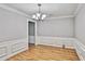 Traditional dining room with hardwood floors, crown molding, and classic chandelier at 1417 Poplar Pointe Se, Smyrna, GA 30082