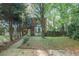 Charming brick two-story home with mature trees and lush landscaping in a desirable neighborhood at 1417 Poplar Pointe Se, Smyrna, GA 30082