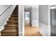 Bright hallway with hardwood floors and staircase at 1417 Poplar Pointe Se, Smyrna, GA 30082