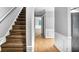 Inviting hallway features hardwood floors, neutral paint, and staircase to the upper level at 1417 Poplar Pointe Se, Smyrna, GA 30082