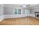 Spacious living room features hardwood floors, fireplace, and natural light, creating an inviting space at 1417 Poplar Pointe Se, Smyrna, GA 30082