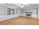 Bright living room with hardwood floors, a fireplace, and french doors leading to the patio at 1417 Poplar Pointe Se, Smyrna, GA 30082