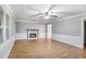 Bright living room features hardwood floors, a fireplace, and crown molding at 1417 Poplar Pointe Se, Smyrna, GA 30082