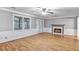 Open living room featuring wood floors, fireplace, and natural light at 1417 Poplar Pointe Se, Smyrna, GA 30082