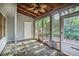 Screened porch featuring a ceiling fan and view of the backyard at 1417 Poplar Pointe Se, Smyrna, GA 30082