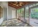 Outdoor screened porch with wooded view and ceiling fan at 1417 Poplar Pointe Se, Smyrna, GA 30082